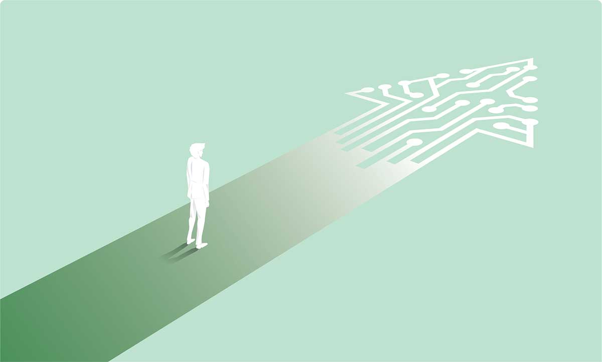 Silhouette of a person standing a path shaped like an arrow. Concept represents the journey to digital transformation